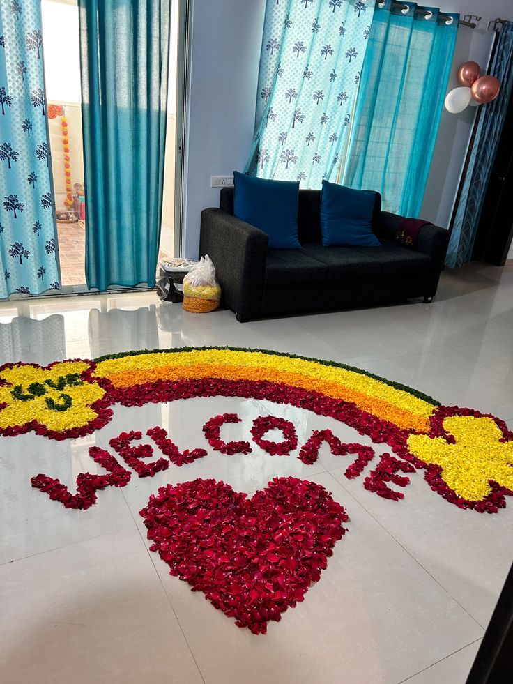 Welcome lettering and a heart made from rose petals and marigolds